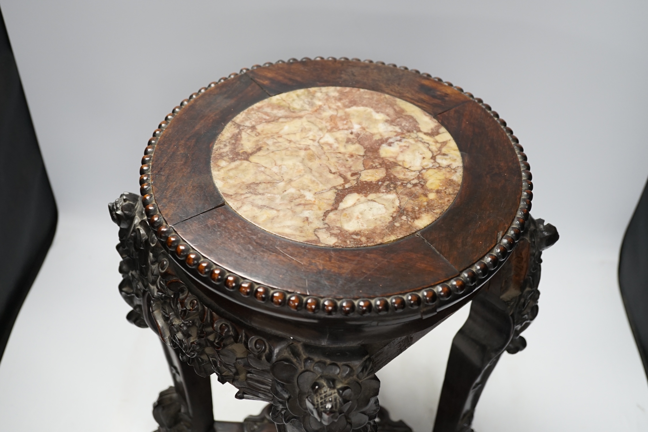 A Chinese hongmu stand, with inset marble top, 42cm high. Condition - poor to fair, section of frieze missing